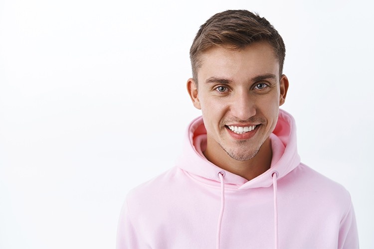 a man with aligned teeth and a beautiful smile
