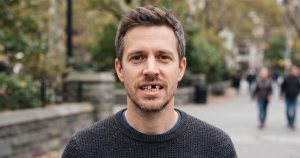 a man with missing teeth that needs know about dental implants vs bridges